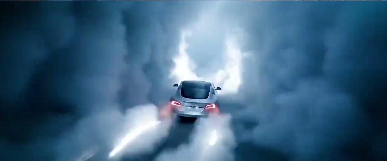 Final frame: Tesla racing through a tunnel of smoke and light